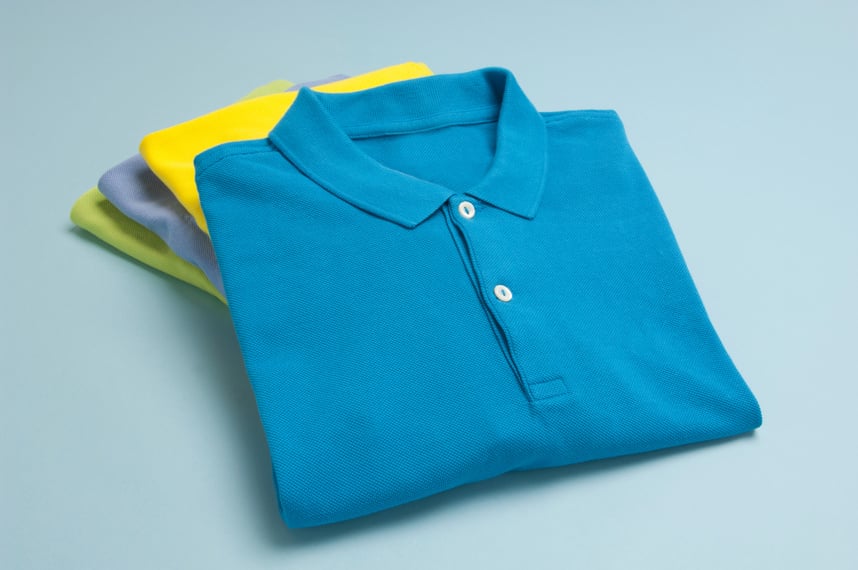 A stack of polo shirts in varying colors